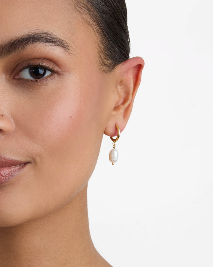 Pearl Charm Huggie Earrings in Gold