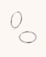 Thin Round Seamless Huggie Hoop Earrings in Silver