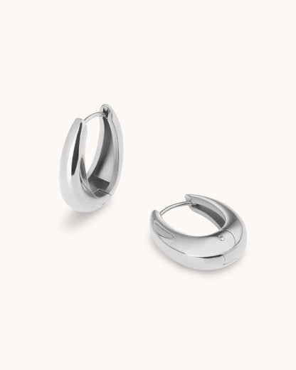 Thick Oval Seamless Huggie Earrings in Silver