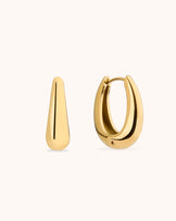 Thick Oval Seamless Huggie Earrings in Gold