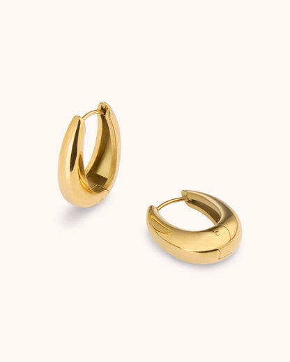 Thick Oval Seamless Huggie Earrings in Gold